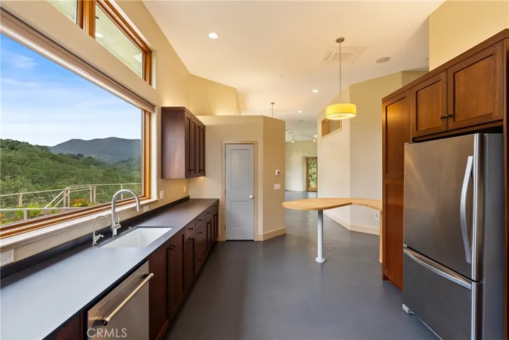 Walk-in pantry across from the breakfast bar.