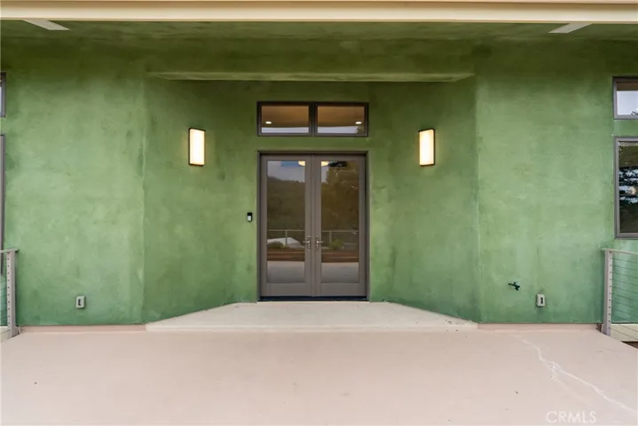 Rich, double glass doors and covered entry.
