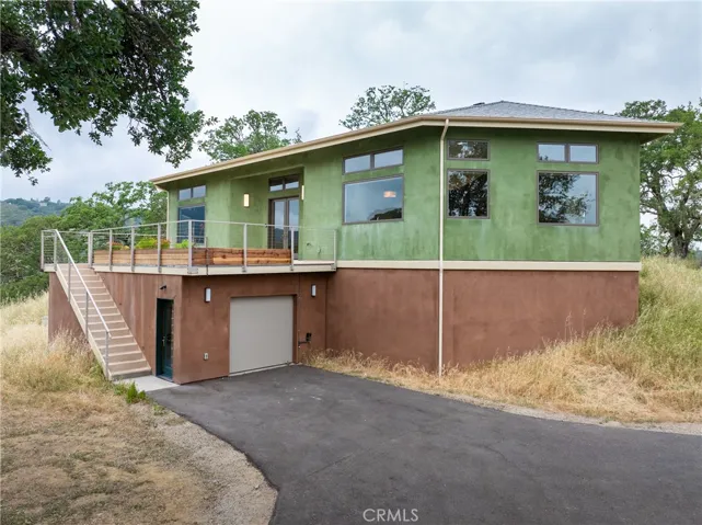 Single-level living with spacious one-car garage below and ample parking throughout the property.