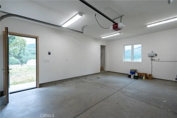 The one-car garage is finished and lit with a single door as well as remote controlled garage door.