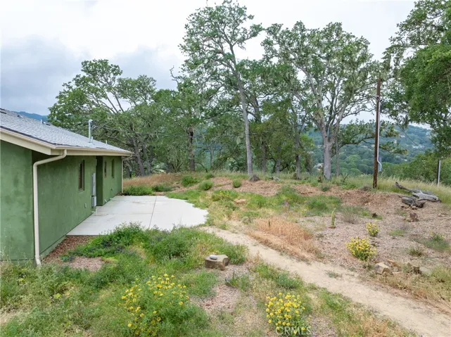 The backyard is a blank canvas featuring a concrete patio waiting for you to design the outdoor living space of your dreams.
