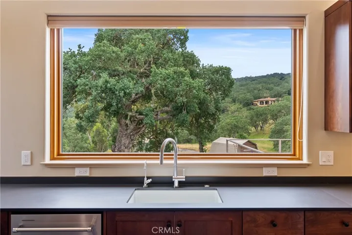 Picture window above the kitchen sink.
