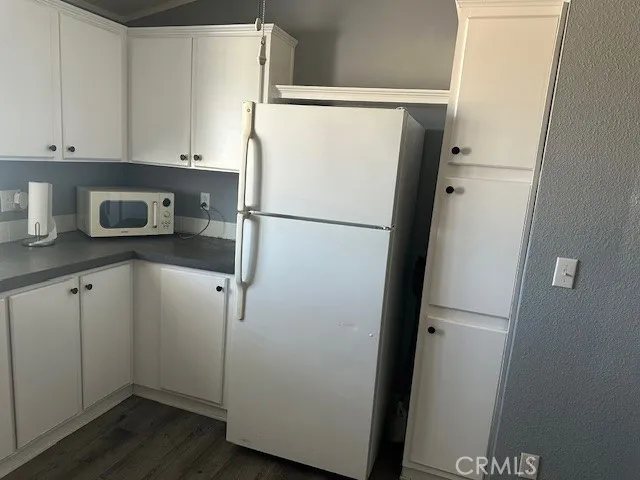 Showing one side of the kitchen refrigerator included.