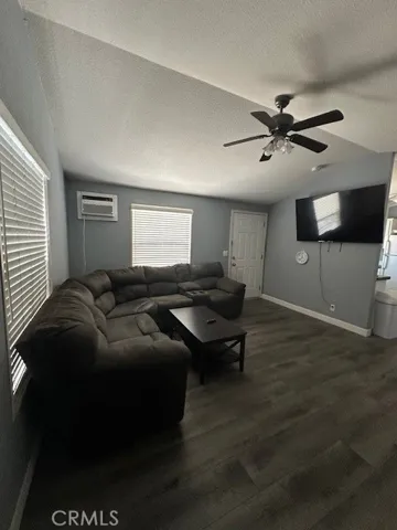 Livjng Room with ceiling fan and TV included.
