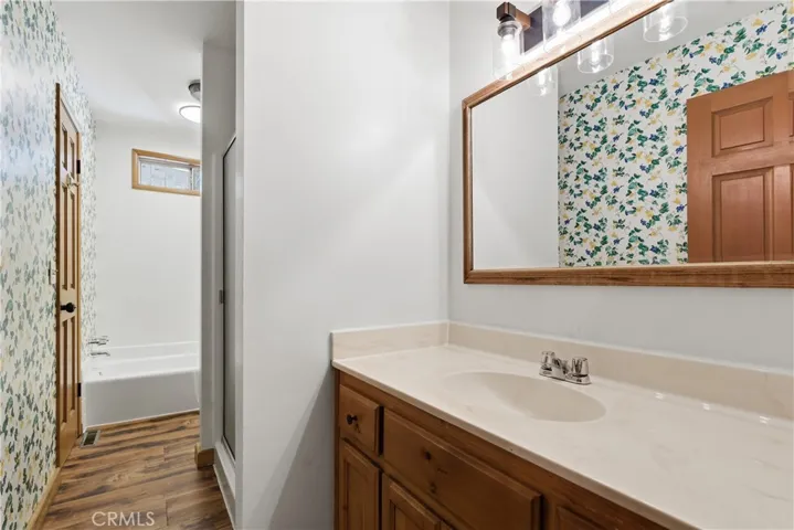 Guest bathroom with shower and bathtub.