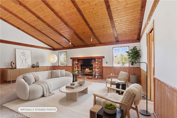 Spacious Living Room, with beamed vaulted ceiling and cozy fireplace.
