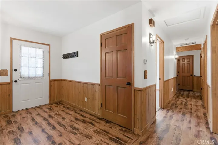 Entrance door with wainscoting, laminate flooring