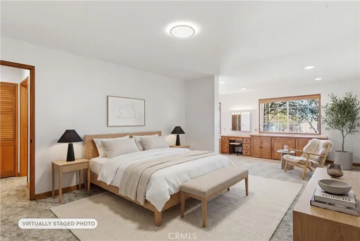 AI Virtually Staged photo of spacious Primary Bedroom.