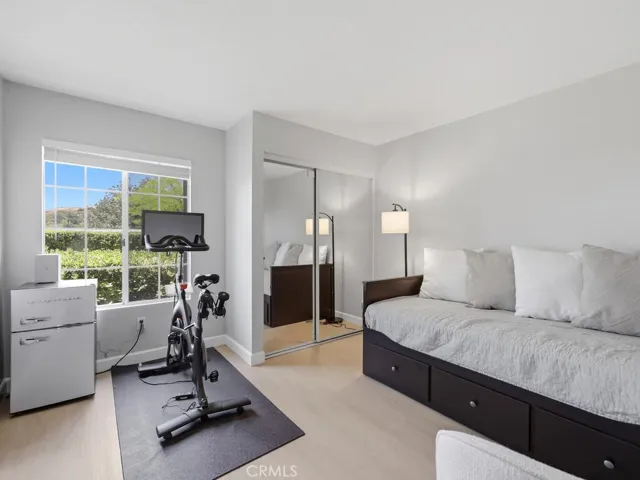 Bedroom #2 with mirrored wardrobe and greenbelt view