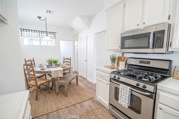 Kitchen with eat in dining, virtually staged.
