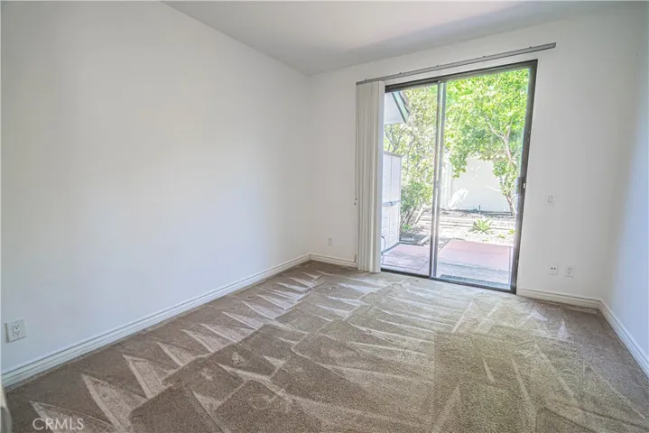Downstairs guest bedroom with ensuite and access to patio.