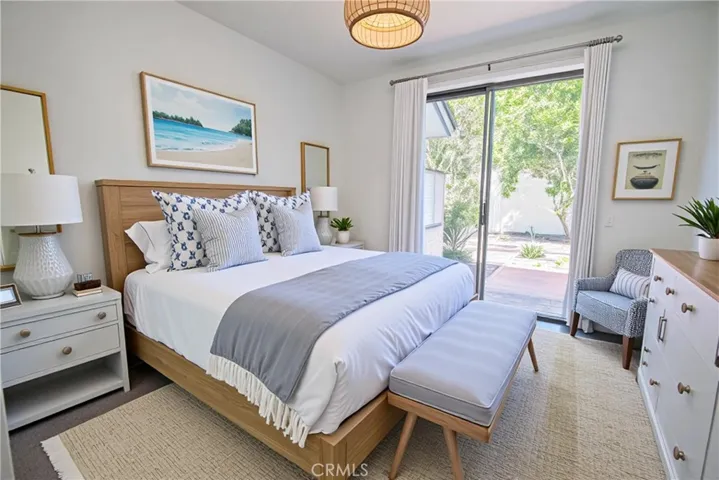Downstairs guest bedroom with ensuite and access to patio.