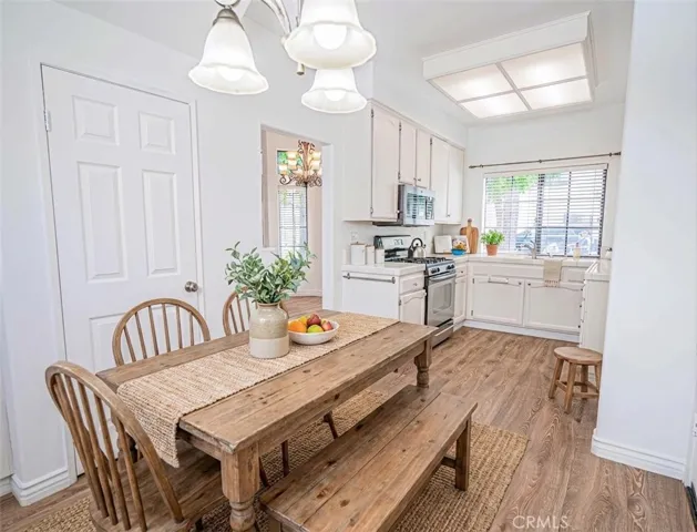 Kitchen with eat in dining, virtually staged.