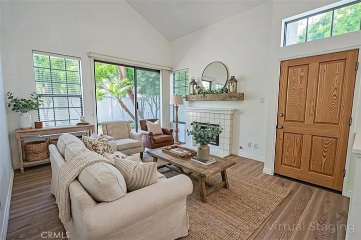 Living Room and Large Patio sliding Door lead to Private patio. Virtually Staged