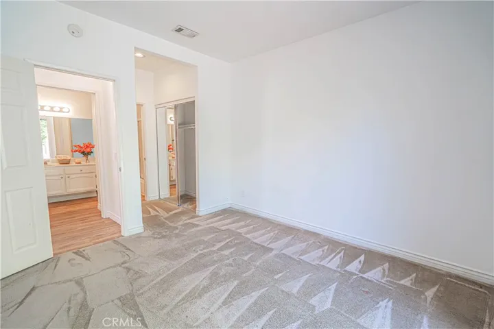 Downstairs guest bedroom with ensuite and access to patio.