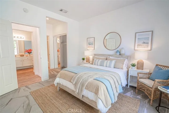 Downstairs guest bedroom with ensuite and access to patio. Virtually staged.