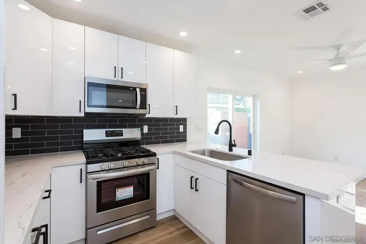 Modern clean and bright kitchen with newer appliances