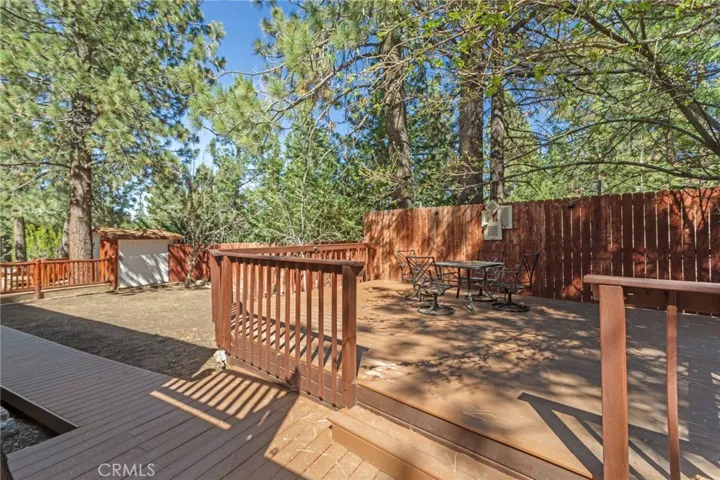 This is a raised deck for barbecuing and just sitting notice the apple trees