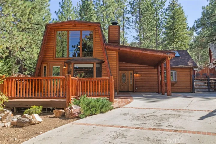 Gambriel style home with carport