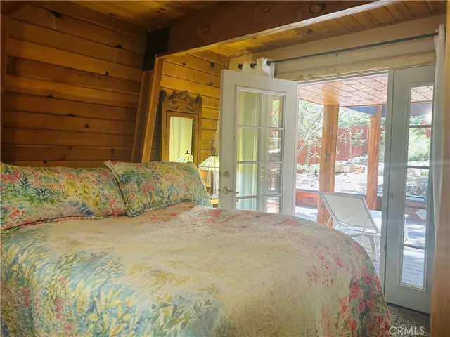 Downstairs bedroom with French doors leading out to your deck