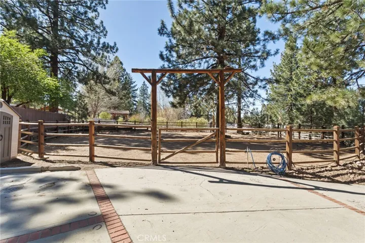 Large round pen on the right side of your driveway