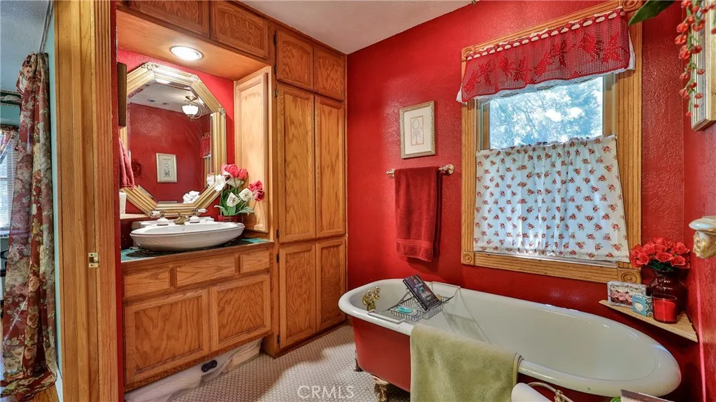 primary bath with claw foot soaking tub