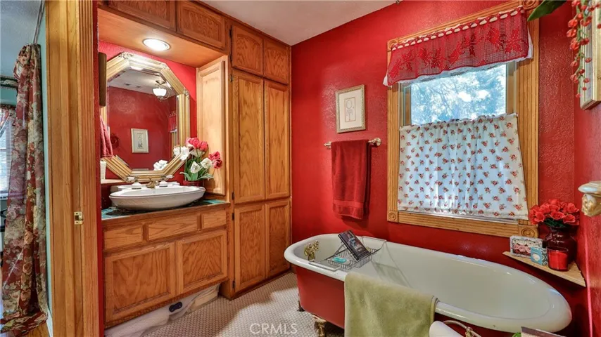 primary bath with claw foot soaking tub
