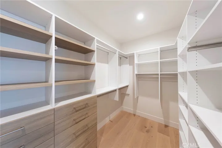 Primary Walk In Closet with Built-Ins