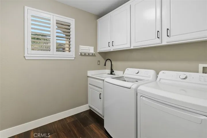 laundry room with sink & storage cabinets