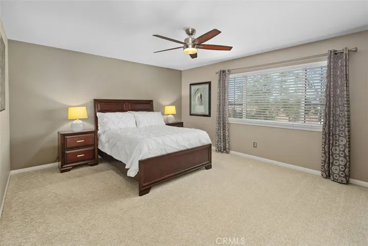 Primary suite with ceiling fan