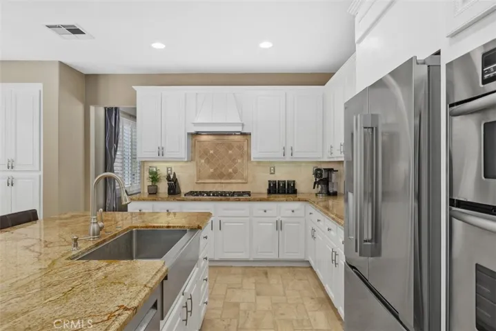 Center island with stainless steel farm sink