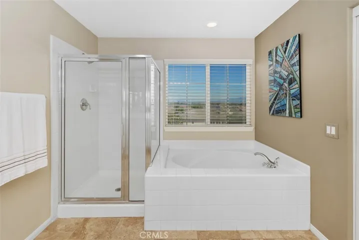 Primary bathroom with soaking tub and walk-in shower