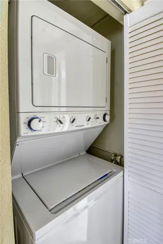 Stack laundry in the hallway.