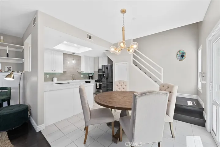 Dining space open to the kitchen and living areas.