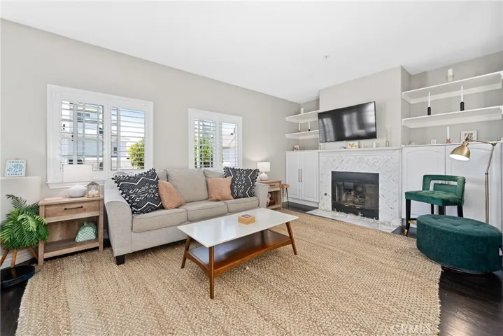 Hardwood flooring, plantation shutters, and shelving add style and fuctionality