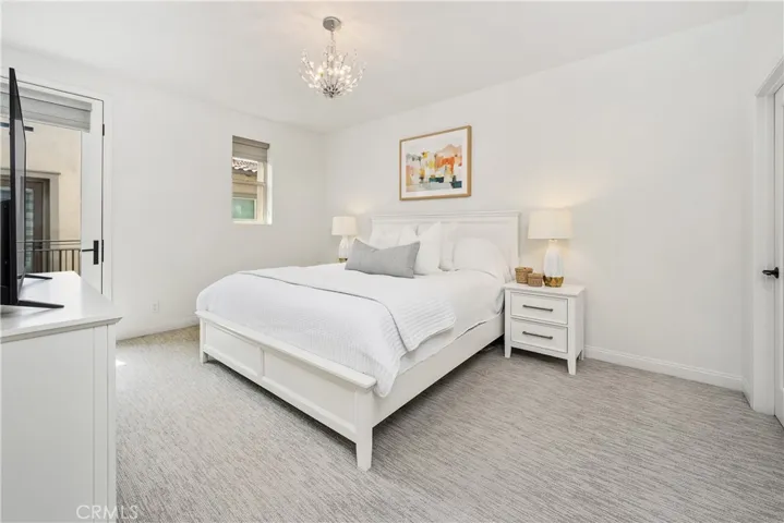 Primary Bedroom is Large! Filled with natural light and has a balcony.
