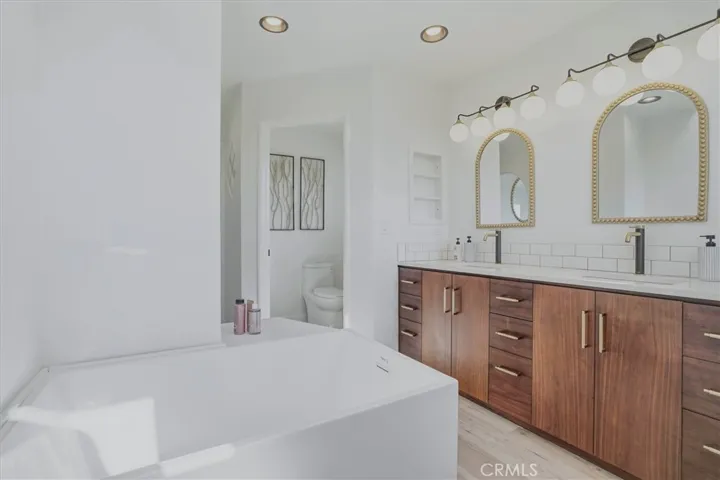 Japanese-Style extra-deep soaking tub, Faucet is being installed.