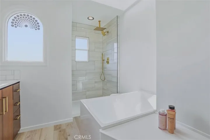 Japanese-Style extra-deep soaking tub, Faucet is being installed.