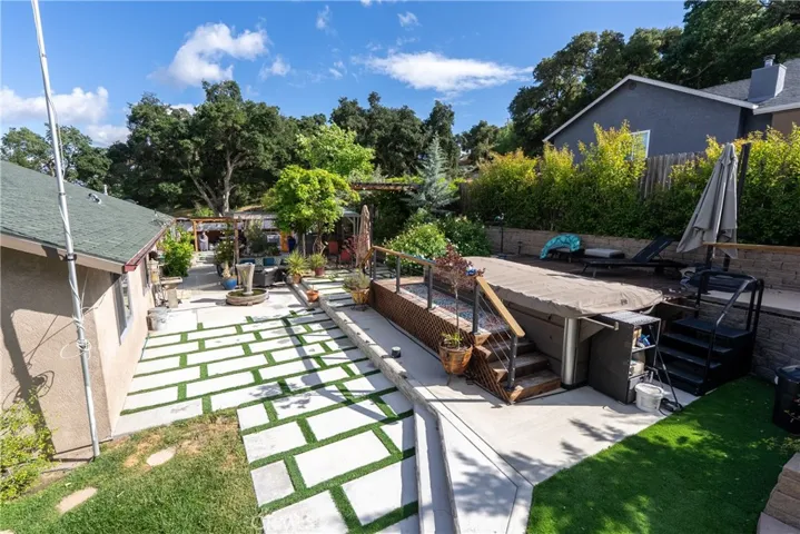 Additional backyard perspective featuring the swim spa to the right