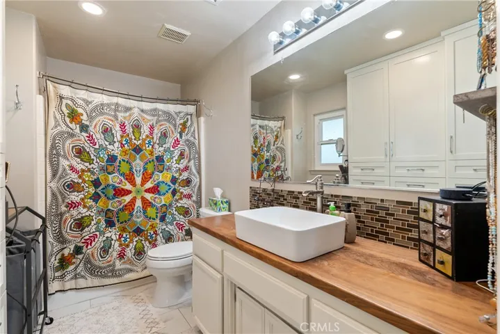 Primary ensuite features a stunning walnut countertop