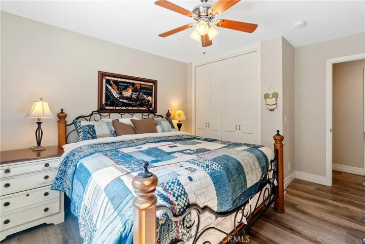 Additional bedroom featuring closet organizers (not visible in photo)