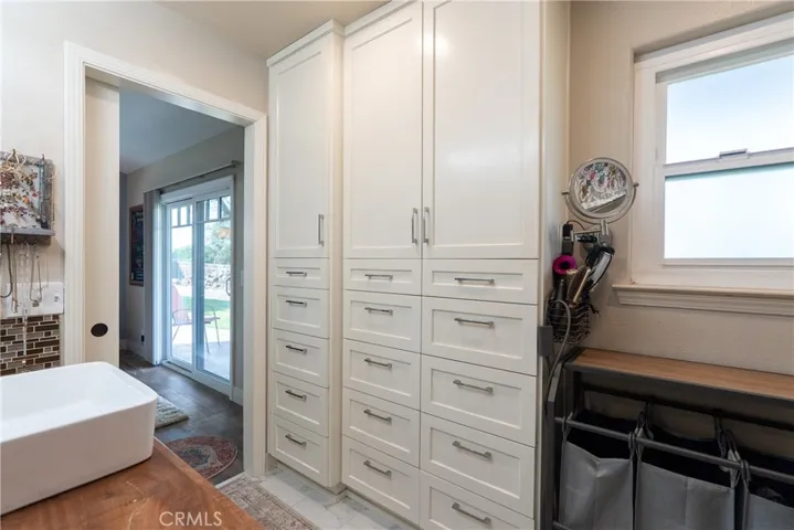 Thoughtfully designed custom cabinetry creates abundant bathroom storage
