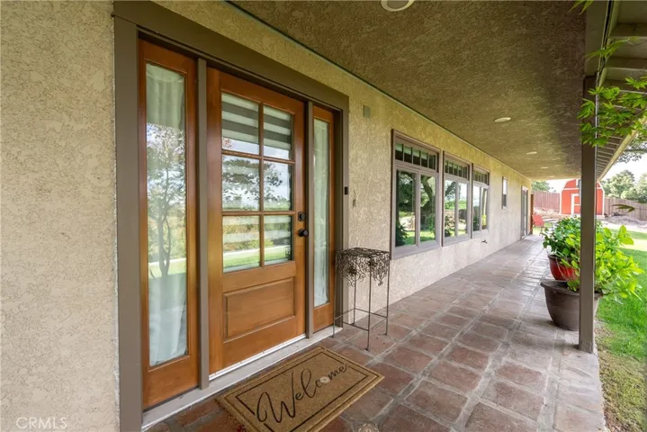 Welcoming front entry highlighted by stunning tile pavers