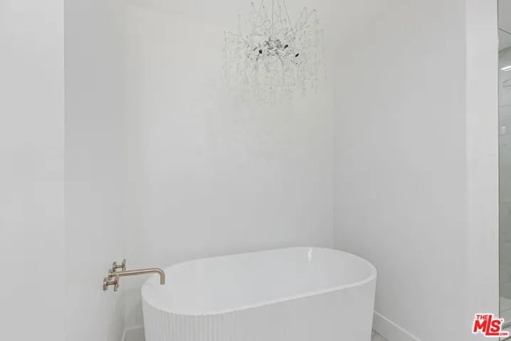 Soaking tub in primary bedroom