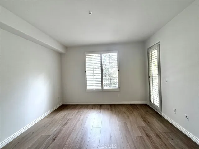 Large primary bedroom with direct access to patio