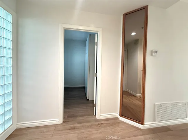 Floor to ceiling mirror in entryway