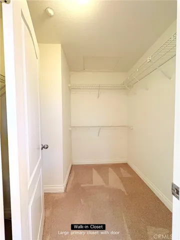 Walk-in closet in primary bedroom