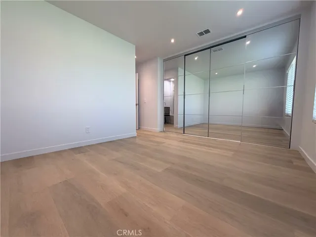Master bedroom view with full closet