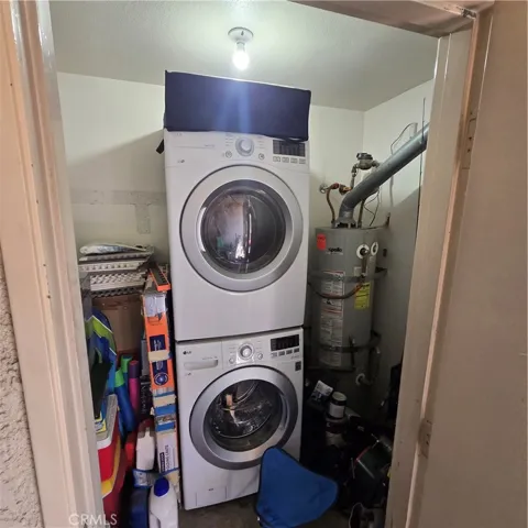 Inside laundry area- can do side by side or stacked. Room for racks and shelves.