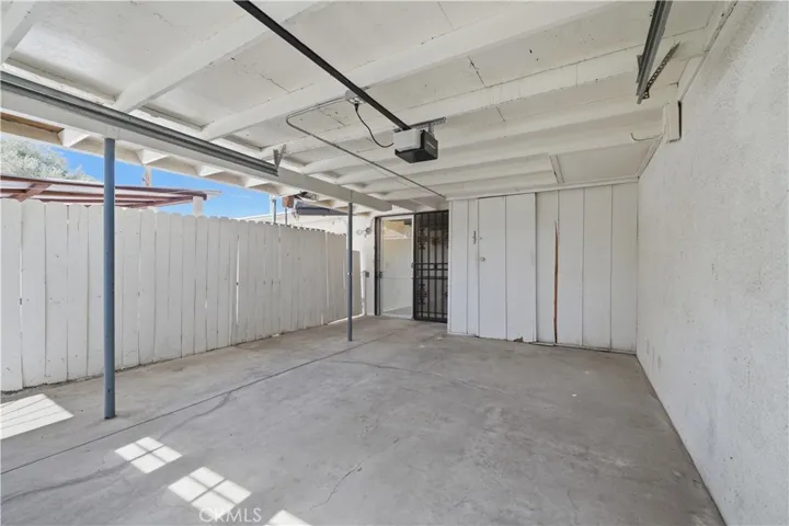 Garage and security screen at entry to home.